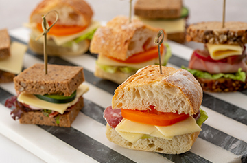 Mini sandwiches with Brie slices 
