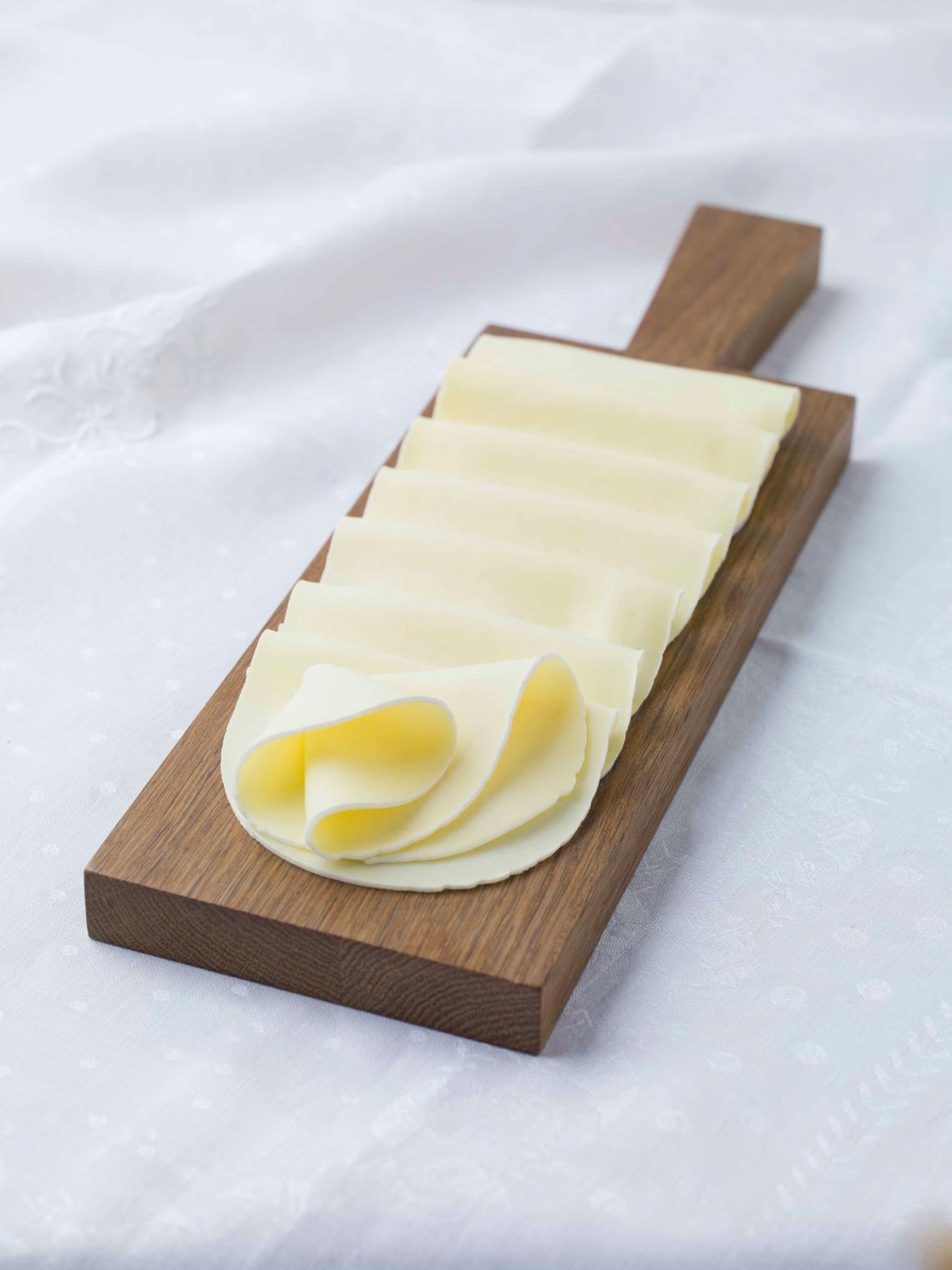 ILE DE FRANCE® Tranches de Brie on a plate ILE DE FRANCE® Tranches de Brie on a plate